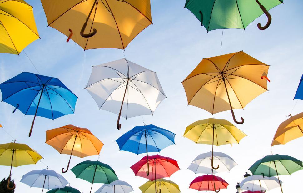 Free Image of Umbrellas flying in the air  