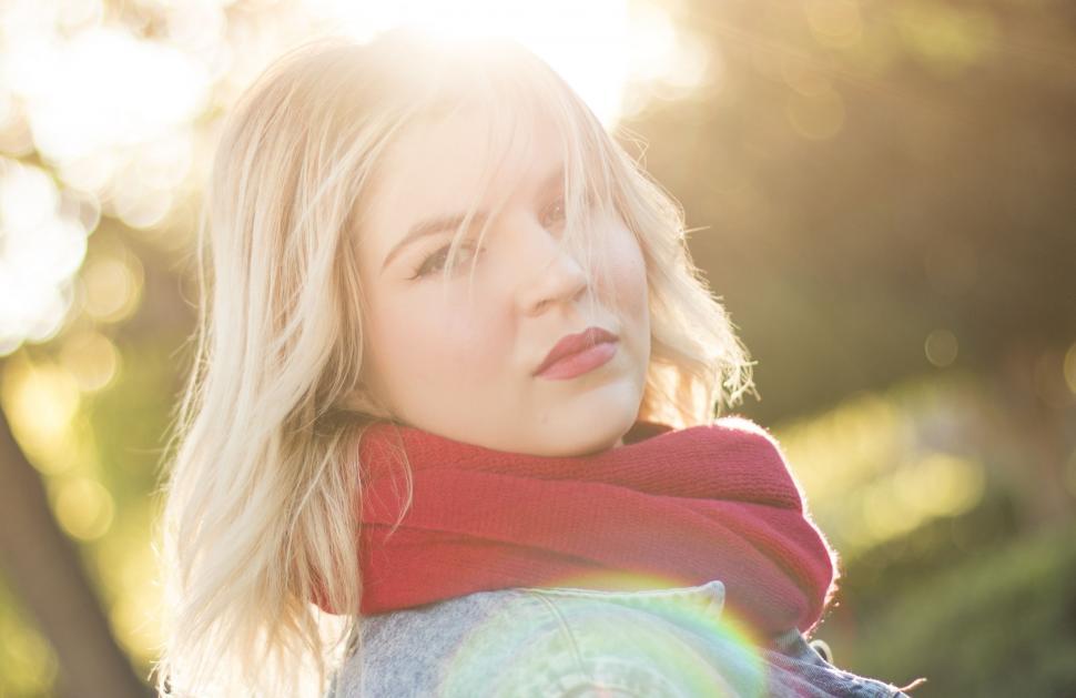 Free Image of Blonde Woman in Red Scarf Looking at Camera  