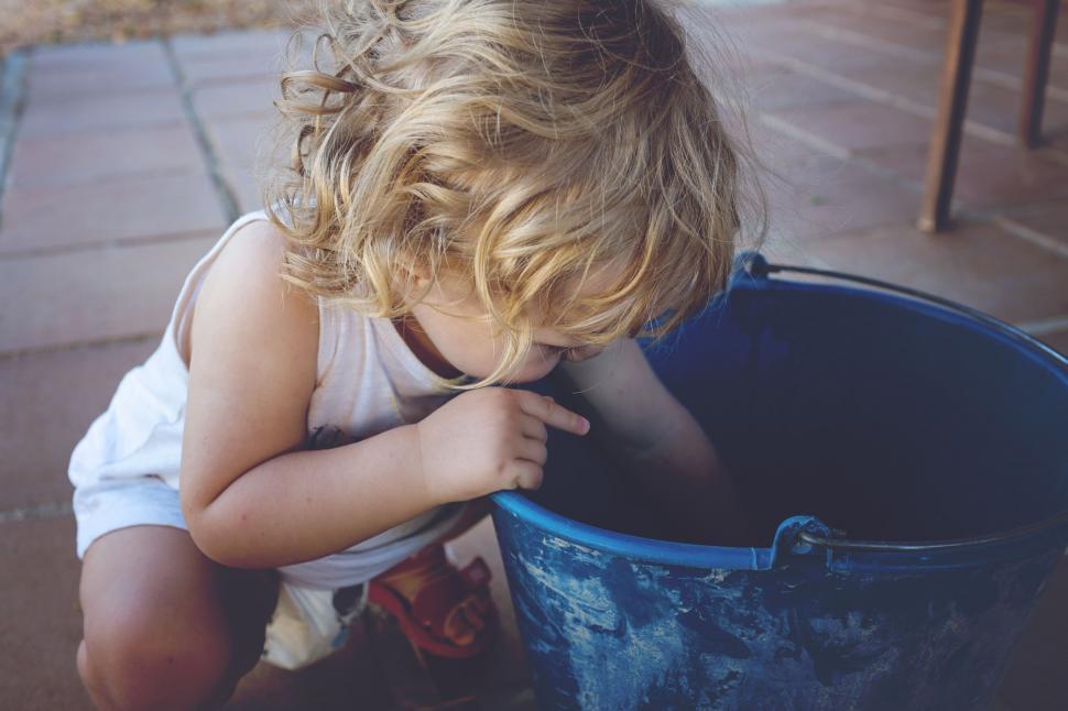 Free Image of Baby Child Playing With Bucket  