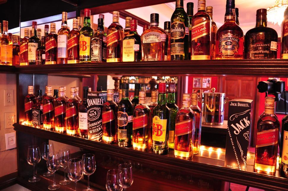 Free Image of Bar with rows of liquor bottles 