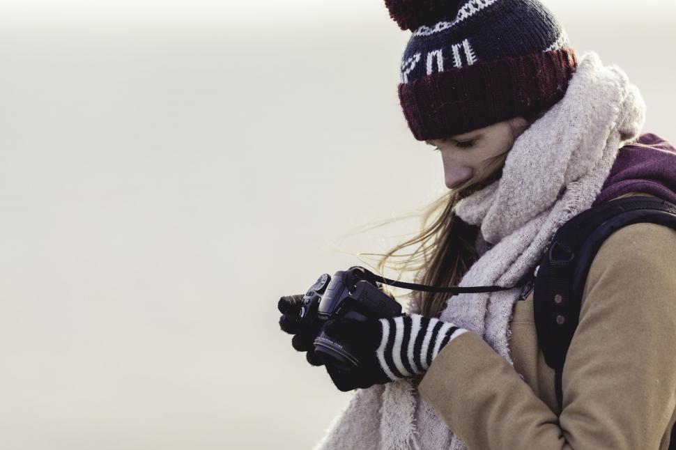 Free Image of Woman Photographer in winter clothing  