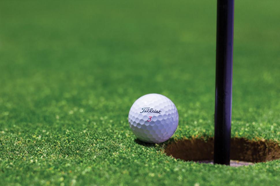 Free Image of Golf ball rolling into the hole  