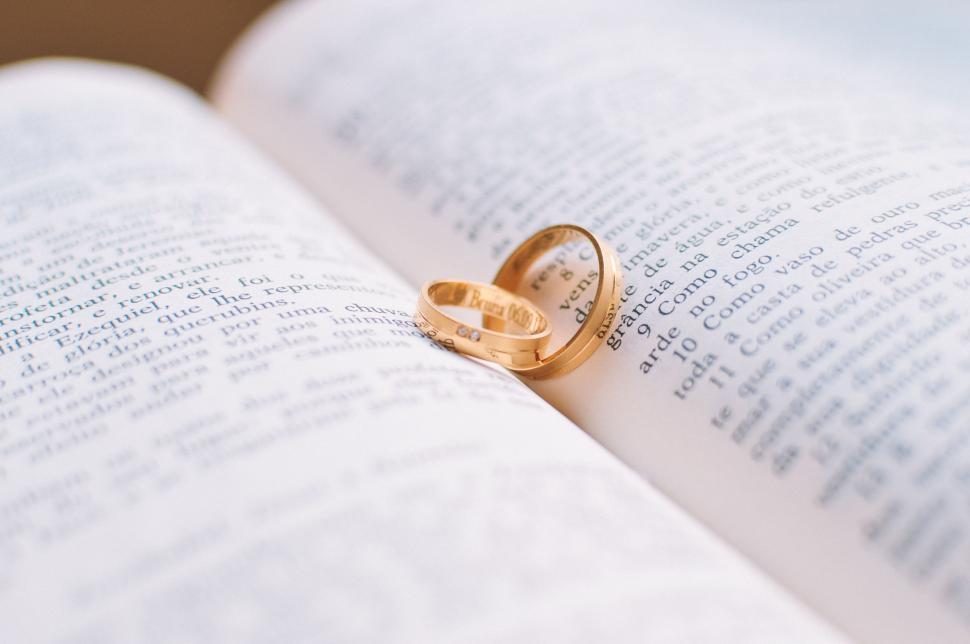 Free Image of Couple Rings on Book  