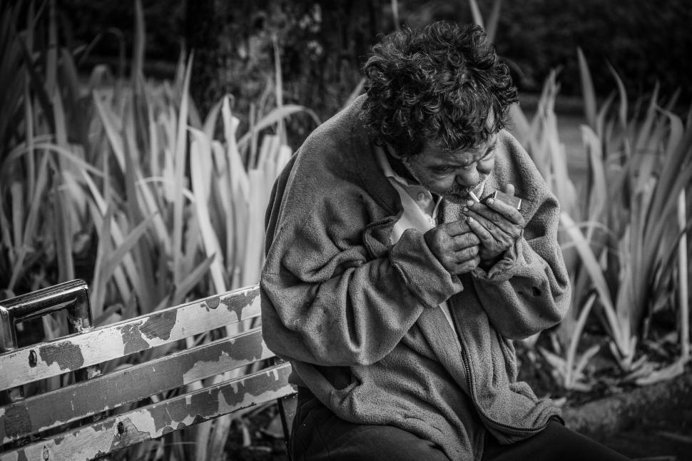 Free Image of Homeless Man Smoking in the park  
