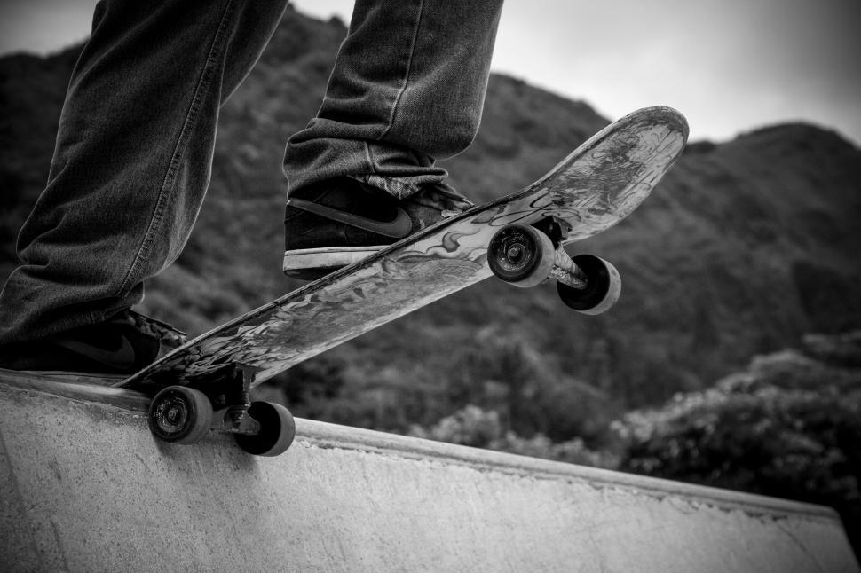 Free Image of Skateboard and Nike Shoes  