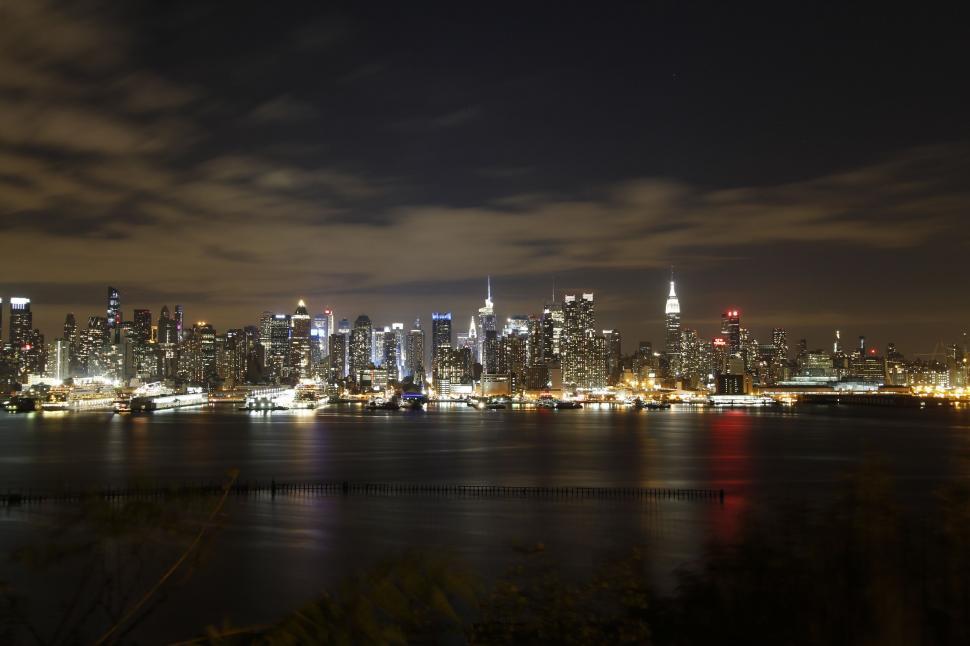 Free Image of City Skylines with waterfront at night  