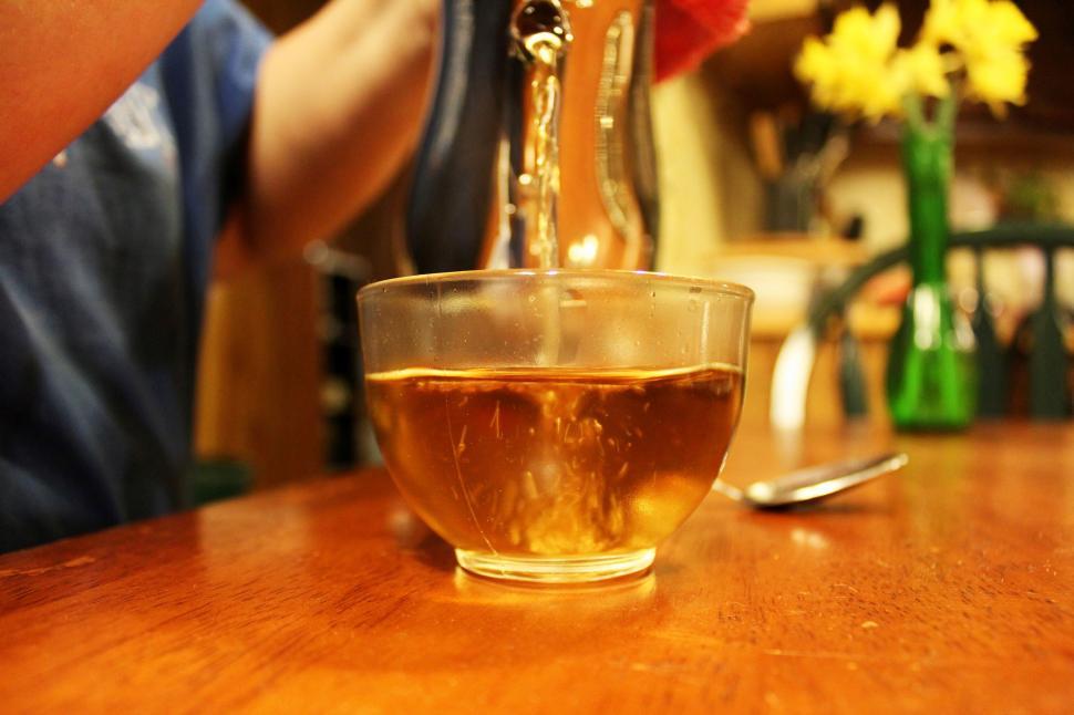 Free Image of Pouring Tea on crystal cup 