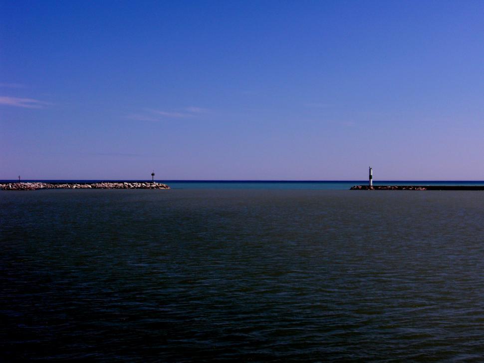 Free Image of Lighthouse on Distant Shoreline 