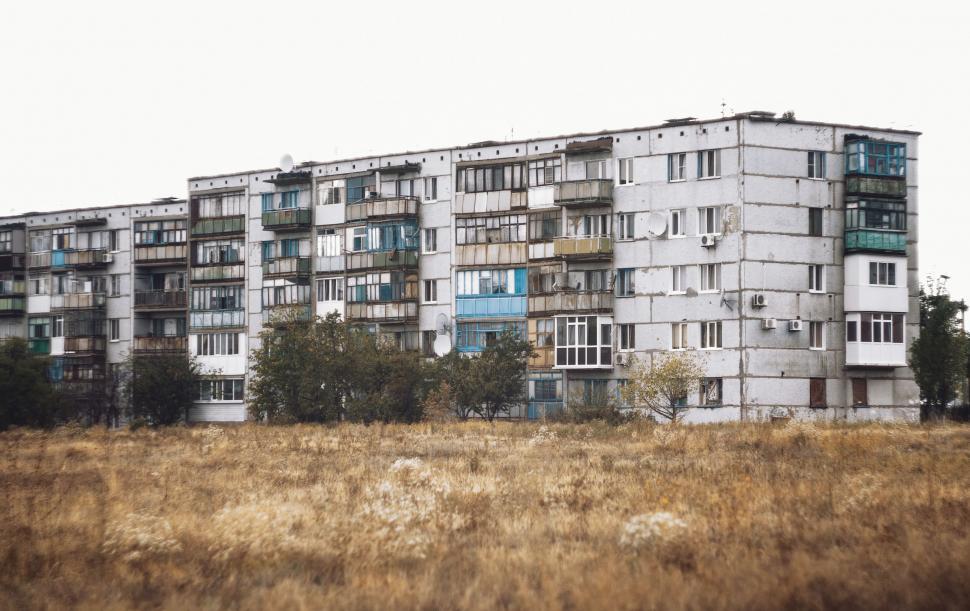 Free Image of Buildings and Brown Grass  