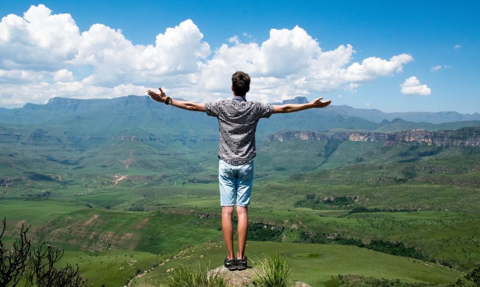 Free Image of Hiker Open arms to mountains  