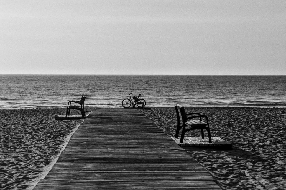 Free Image of Bicycle and Benches on Beach  