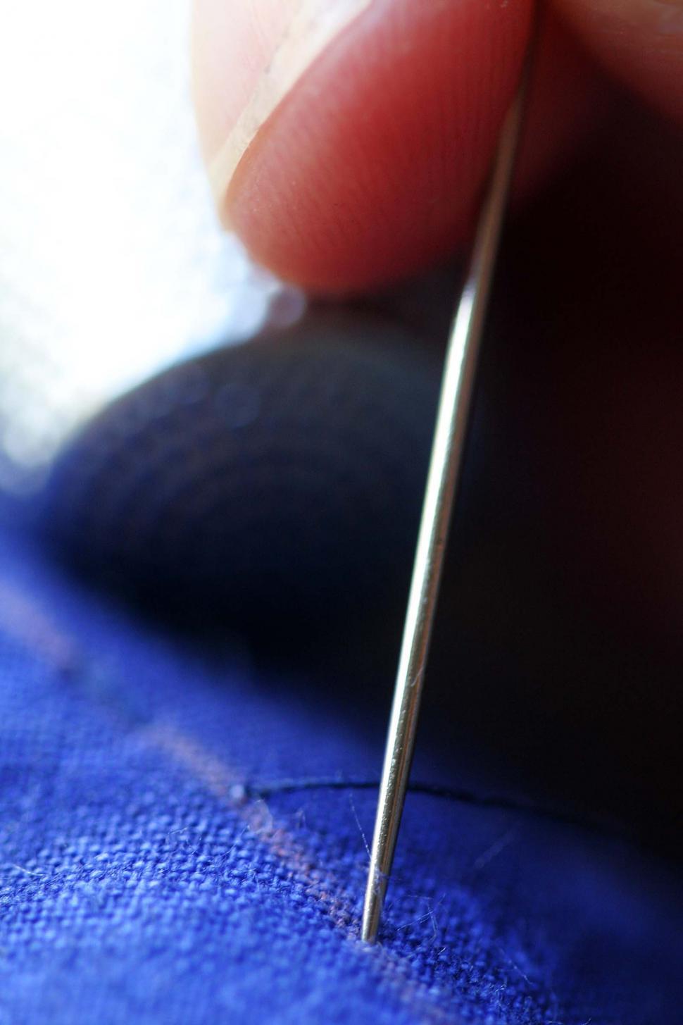 Free Image of Close Up of Person Holding Needle 