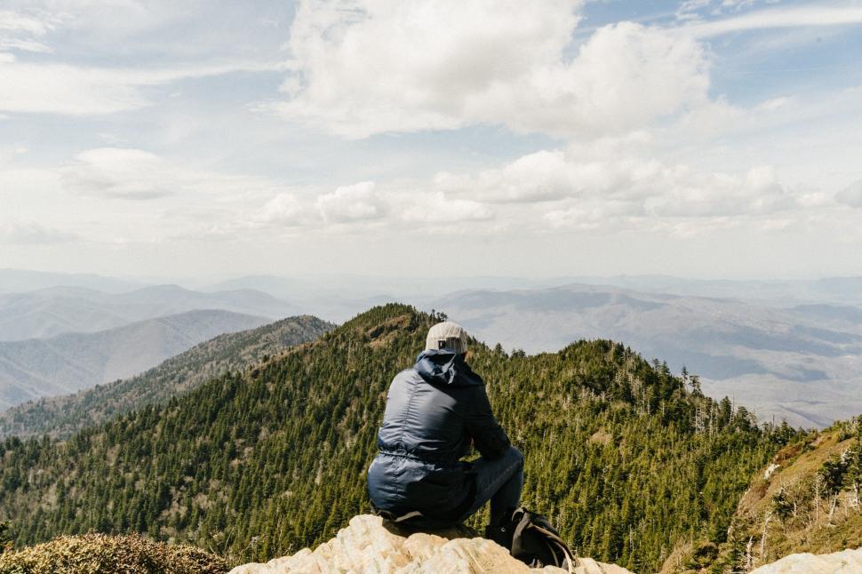 Free Image of Hiker Sitting on Cliff 