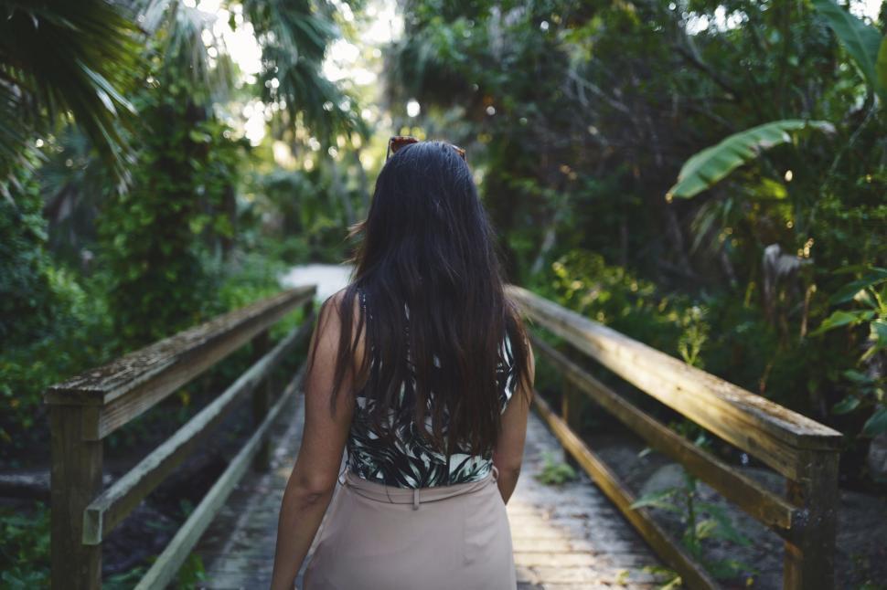 Free Image of Woman on Small Wooden Bridge  