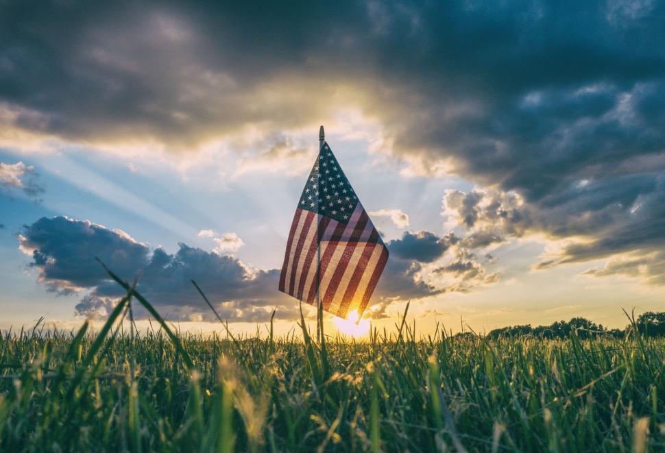 Free Image of USA Flag in field with Sun  