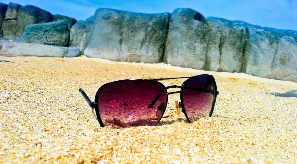 Free Image of Sunglasses on beach sand  