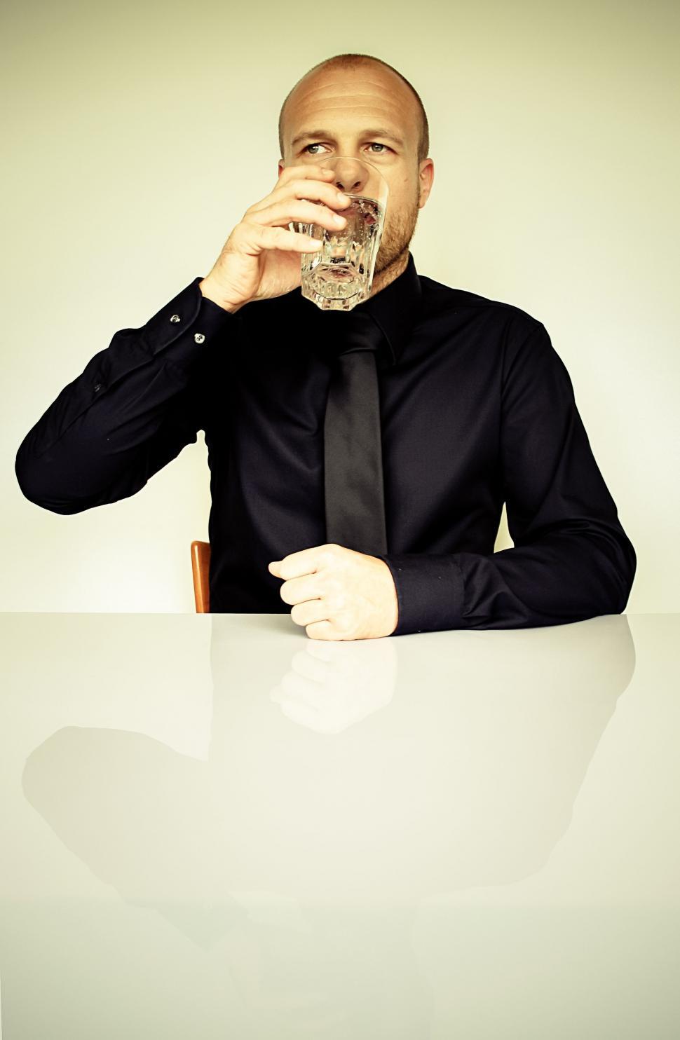 Free Image of Businessman Drinking Water  