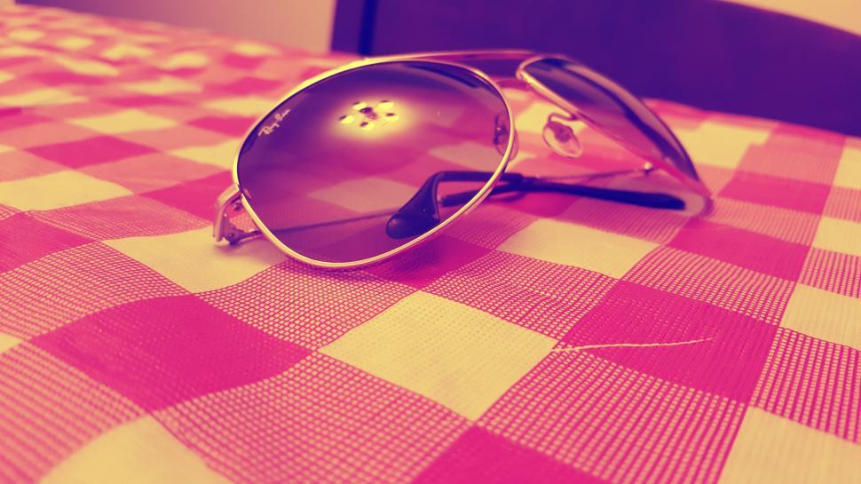 Free Image of Sunglasses on Tablecloth  