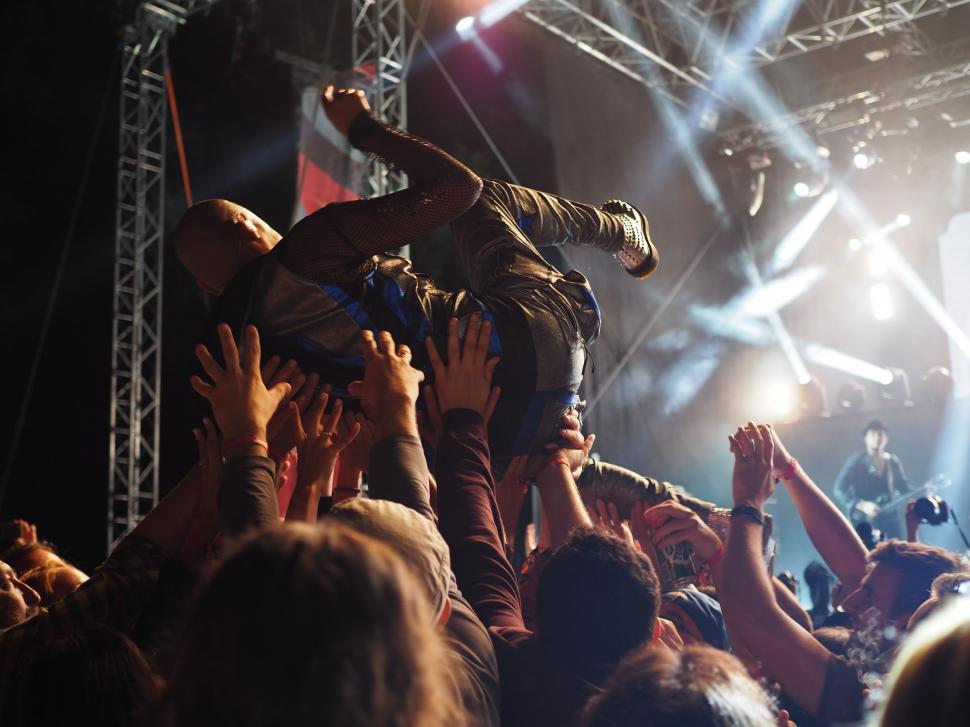 Free Image of Musician on crowd hand 