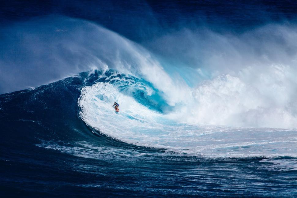 Free Image of Surfer playing with ocean waves  