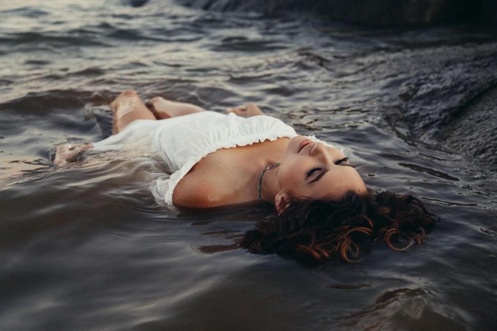 Download Free Stock Photo of Woman Floating on Water  