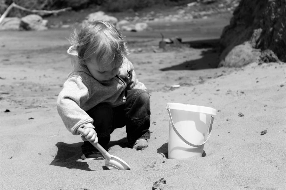 Free Image of Little Boy Playing with sand  