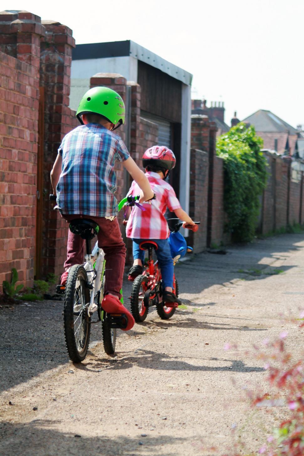 Free Image of Two Children Riding on Bicycles 