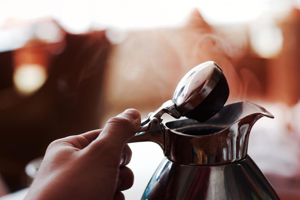 Free Image of Hand and Hot Kettle  