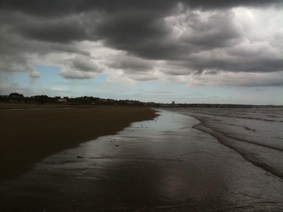 Free Image of Black and white clouds and Beach line  