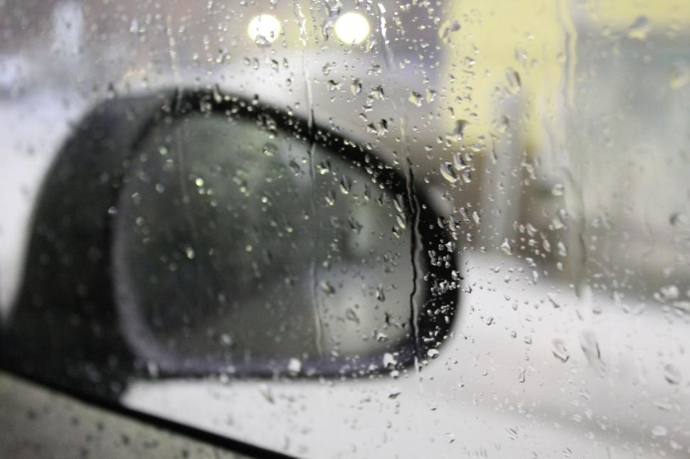 Free Image of Raindrops on Car Mirror 