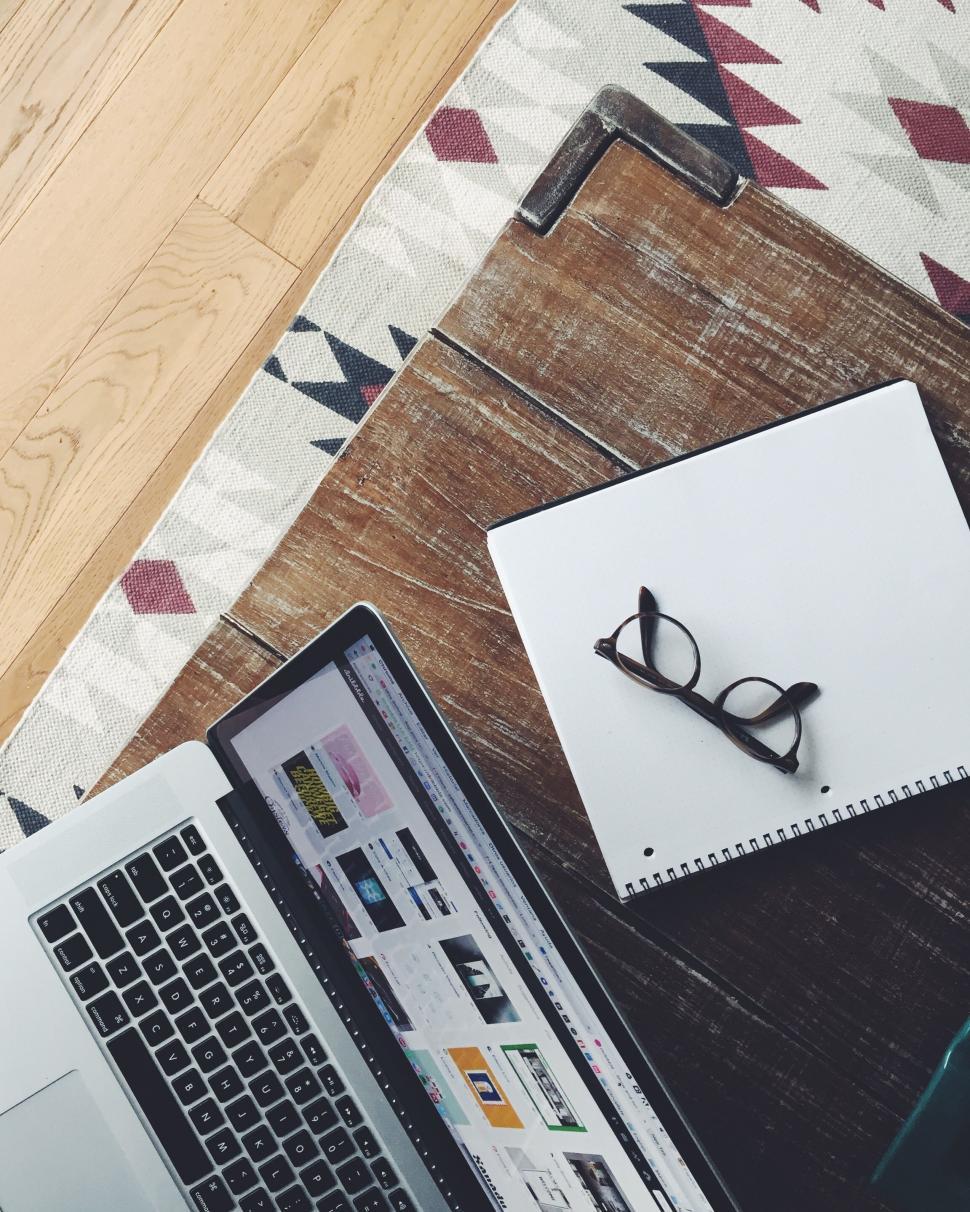 Free Image of Laptop And Spectacles on Wooden Table  