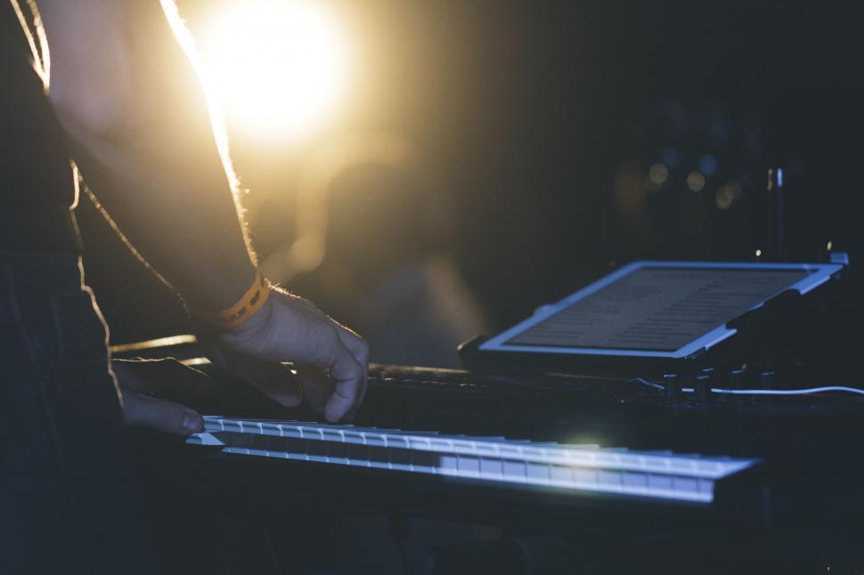 Free Image of Musician on Stage With Piano and Tablet  