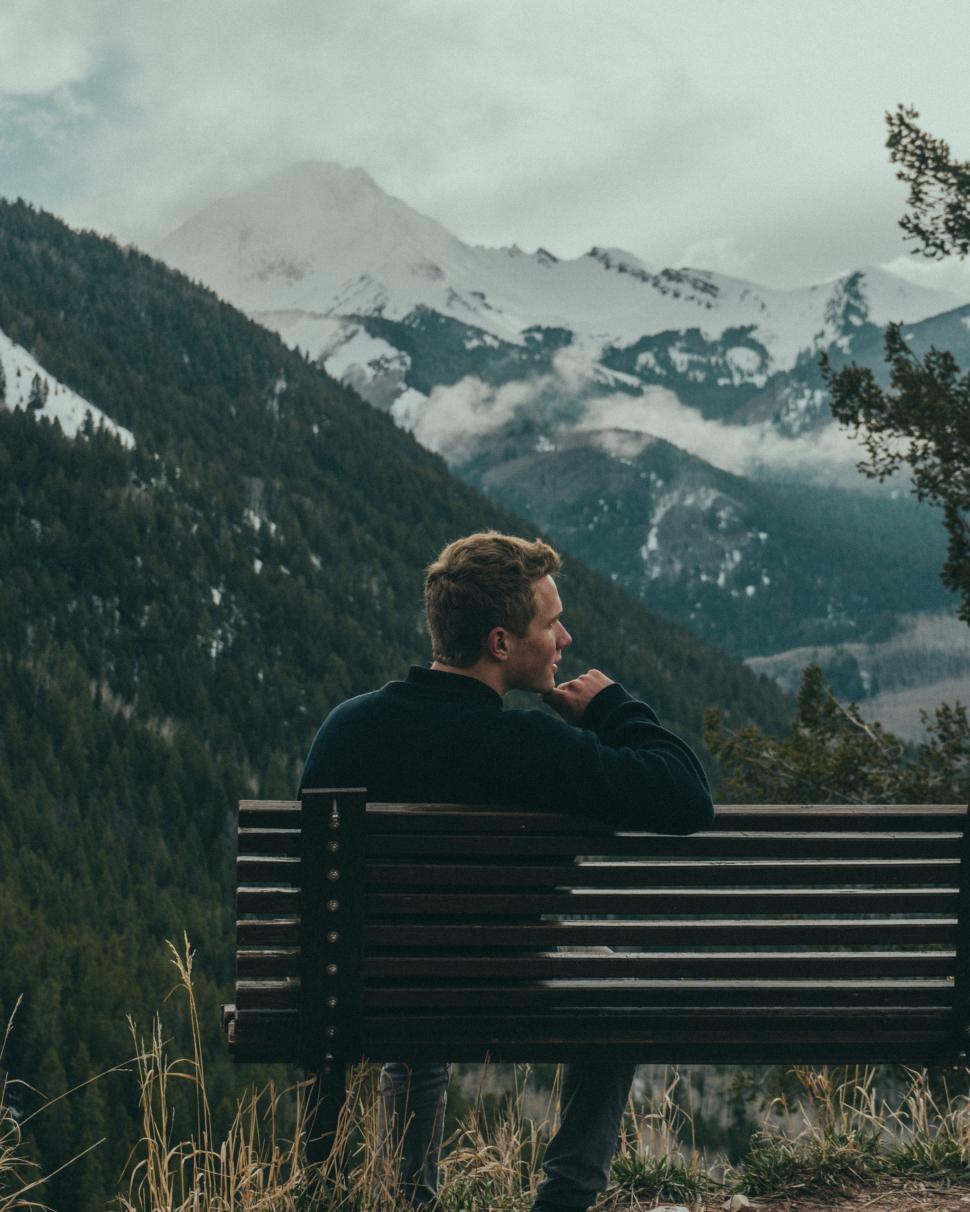 Free Image of Man on bench at mountains 