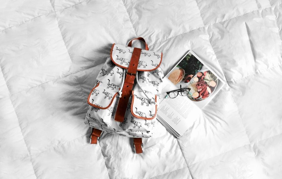 Free Image of Backpack lying on Bed 