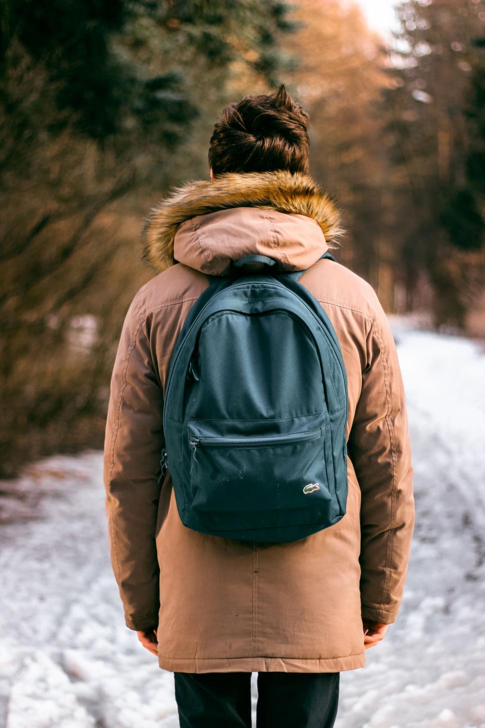 Free Image of Man in backpack and winter jacket  