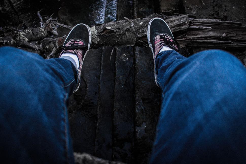 Free Image of Black Sneakers in Feet - Looking Down 