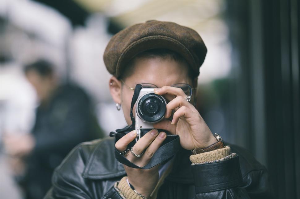 Free Image of Woman with camera - eye contact  