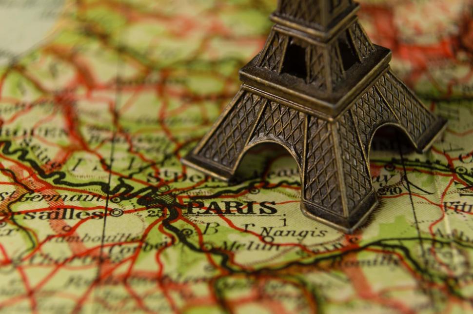 Free Image of  Eiffel Tower Toy on Map  