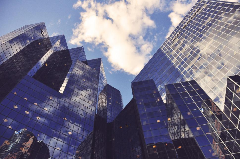 Free Image of Clouds Reflection on Glass Buildings 
