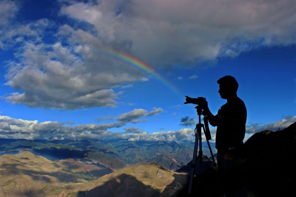 Free Image of Silhouette of photographer with rainbow 
