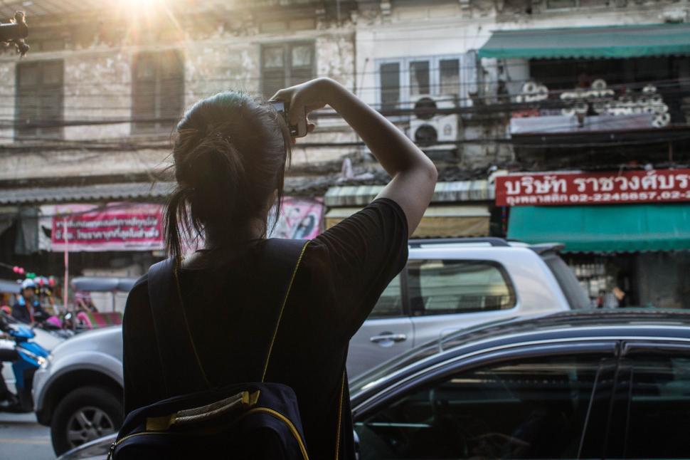 Free Image of Female Mobile Photographer on the Thailand Street  