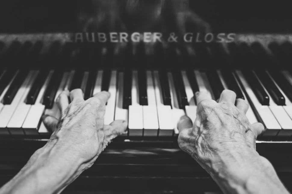 Free Image of Black and white view of Hands on Piano  