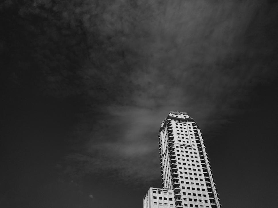 Free Image of Black and White view of Building with Black Sky  