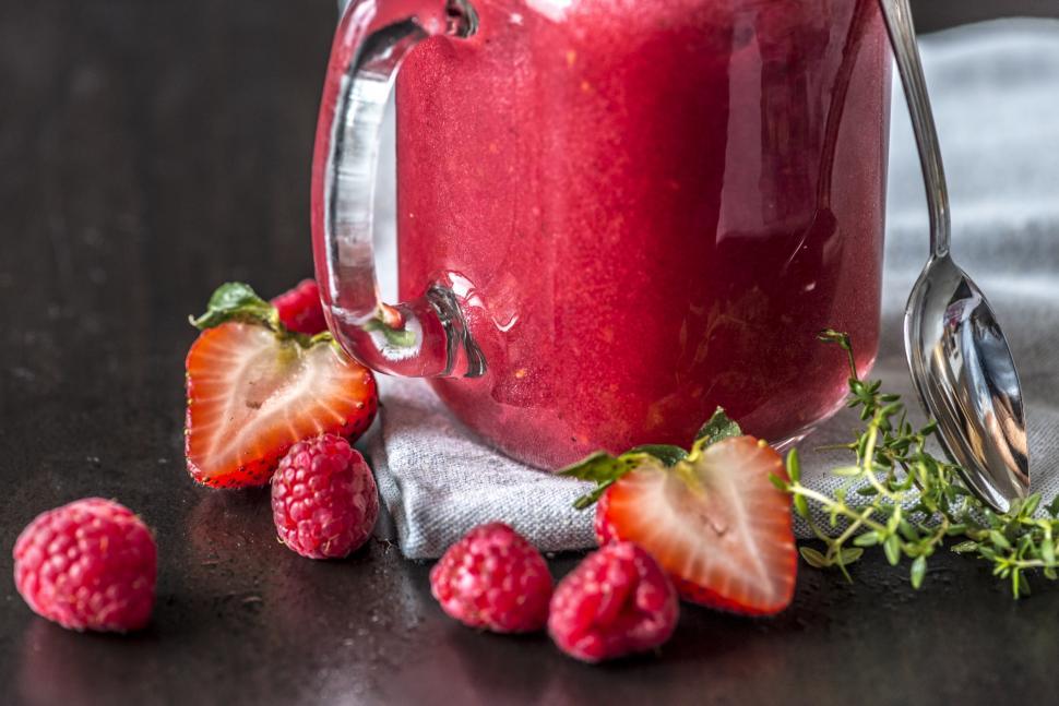Free Image of Close up of fresh strawberry and raspberry smoothie in a jar 