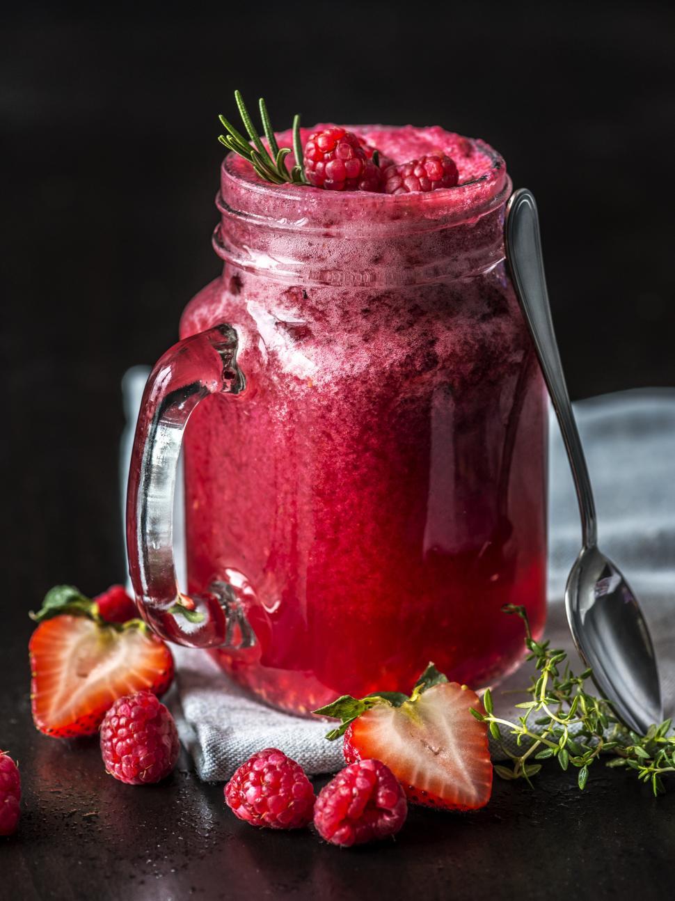 Free Image of Strawberry and raspberry smoothie in a jar 