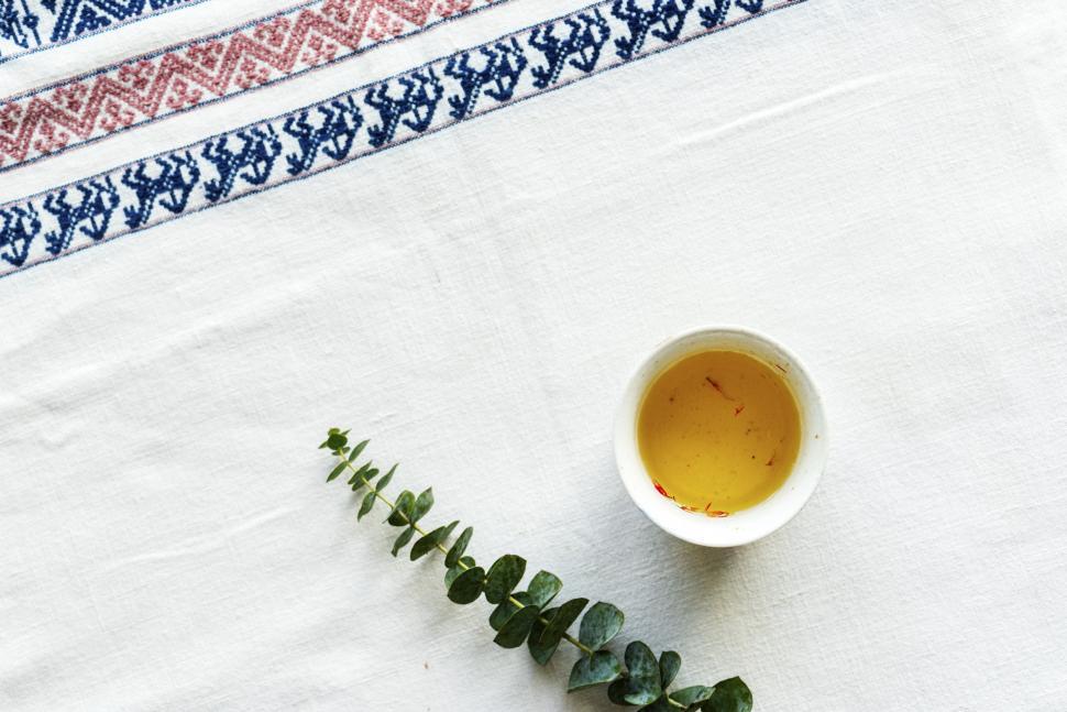 Free Image of Flat lay of a cup of saffron tea 