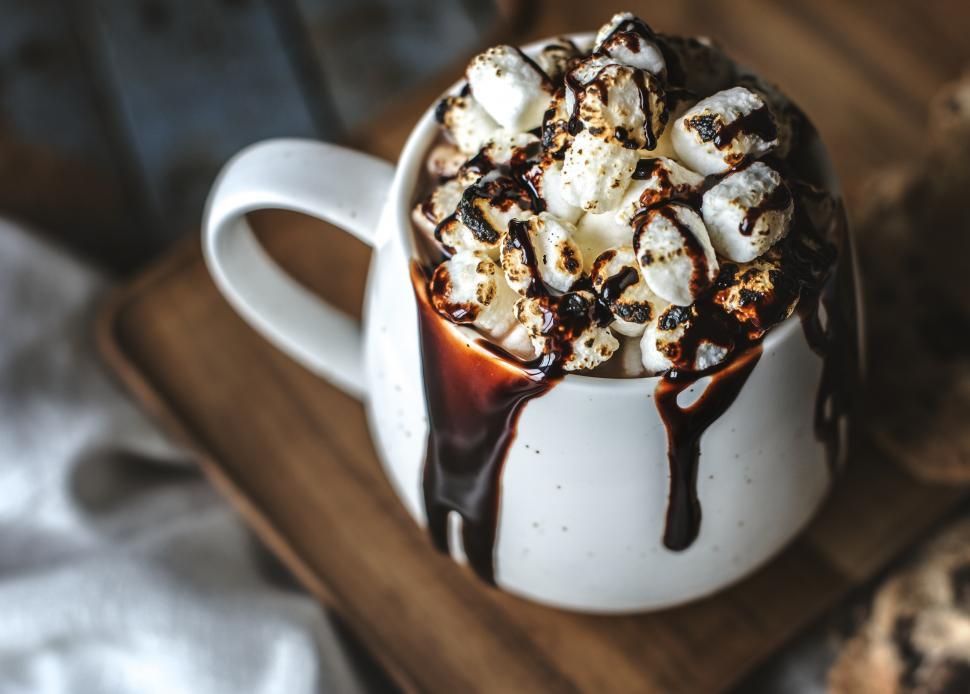 Free Image of Messy hot chocolate with marshmallows and chocolate sauce 