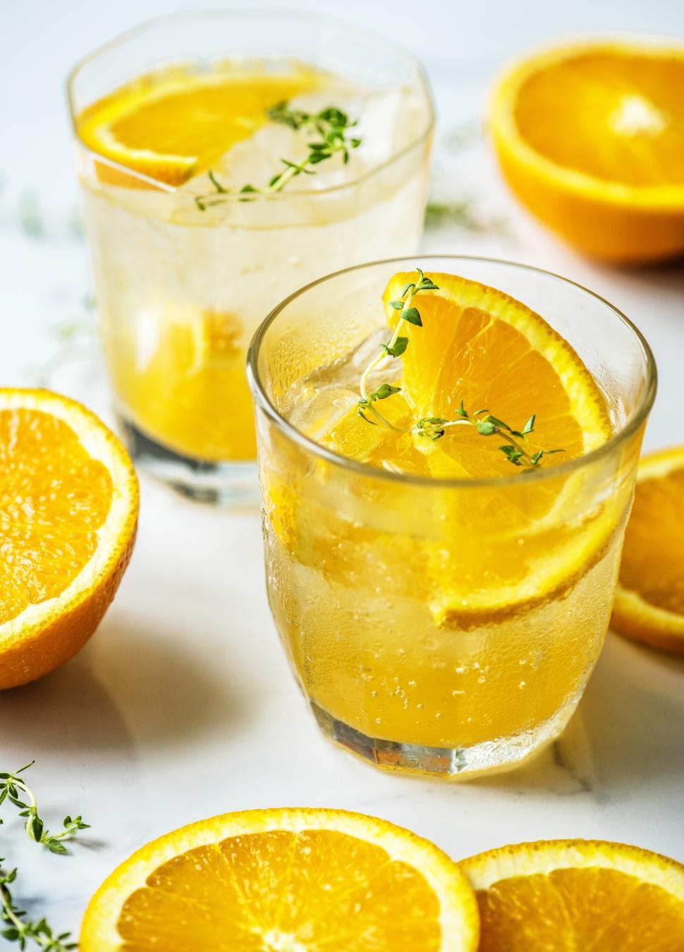 Free Image of Chilled beverages in glasses garnished with orange slices 