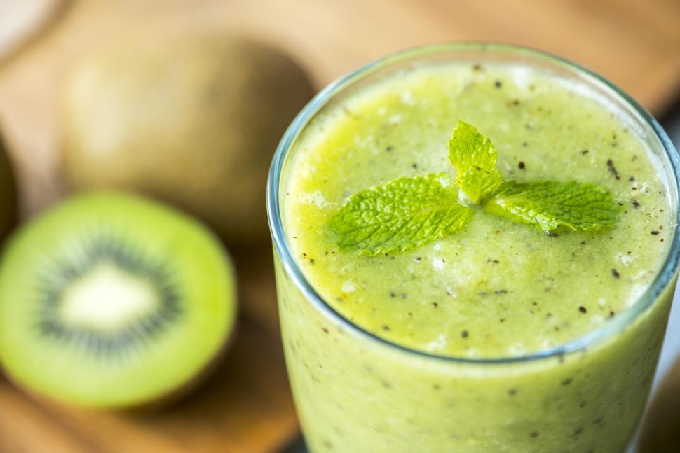 Download Free Stock Photo of Close up of a glass of kiwi smoothie with mint 