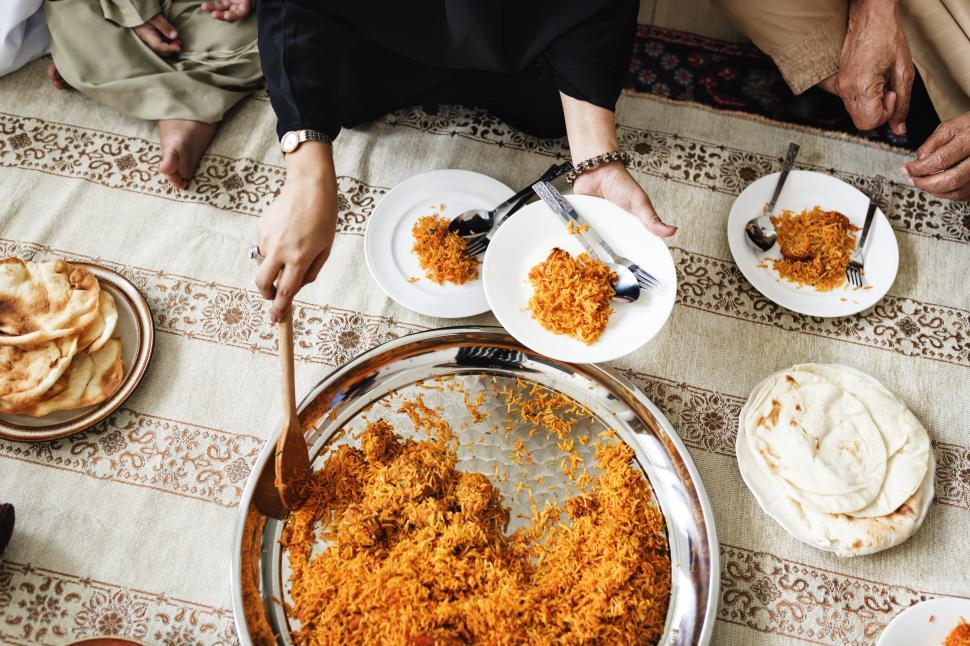 Free Image of Overhead view of Biryani being served 